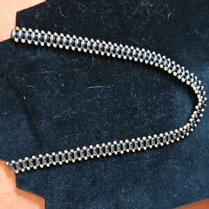 Sassy Hematite necklace with gold tone accents.